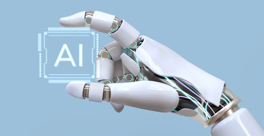Vista de una mano robótica que sostiene en sus dedos la palabra AI (inteligencia artificial)